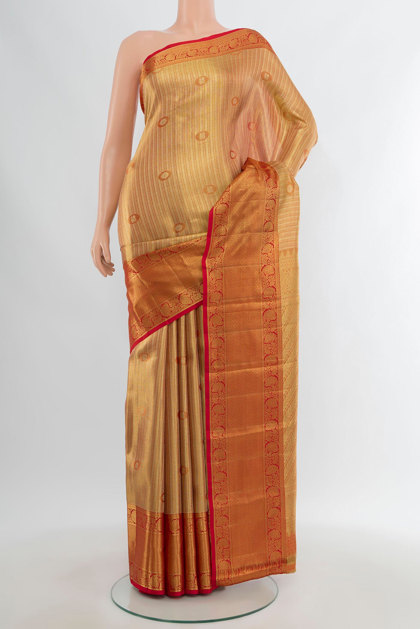 Golden Kanchipuram Tissue Silk Saree with Zari Brocade on the body and Zari Border.  displayed on a mannequin