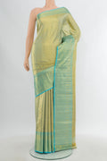 Golden Kanchipuram Tissue Silk Saree with Zari Brocade on the body and Zari Border.  displayed on a mannequin