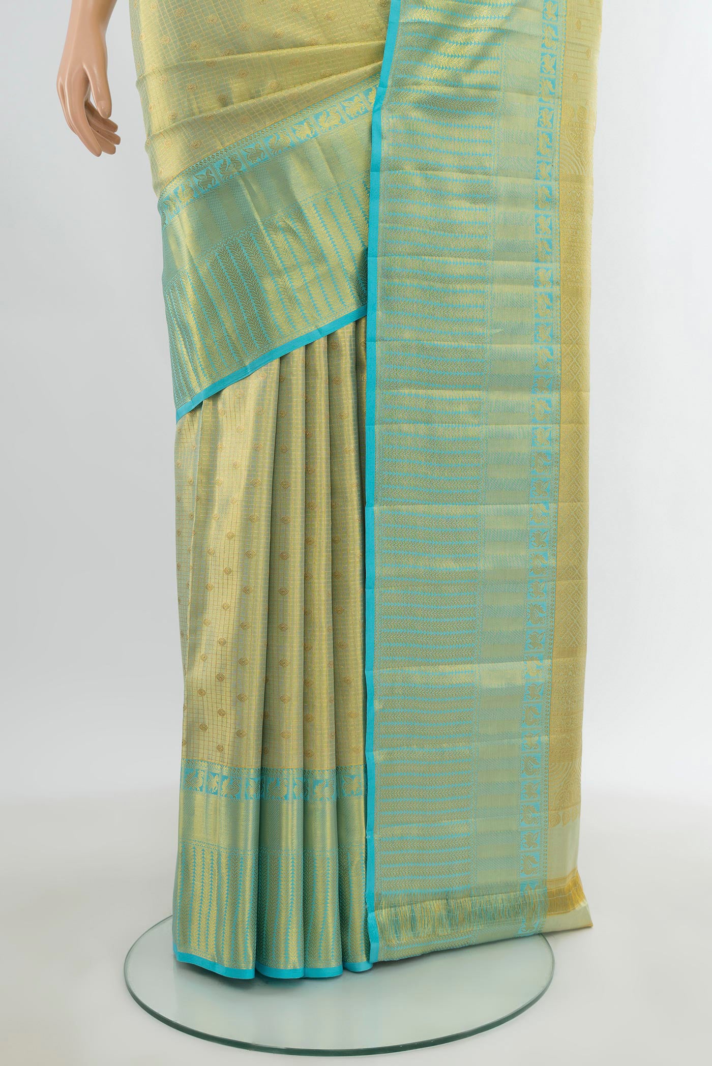 Pleats and pallu of Golden Kanchipuram Tissue Silk Saree with Zari Brocade on the body and Zari Border. 