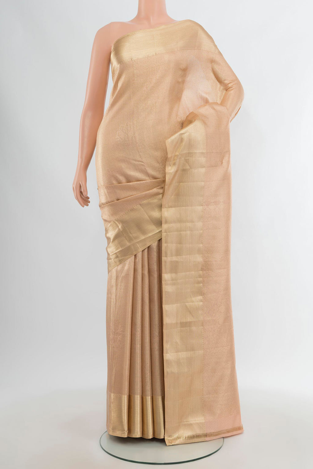 Rose Gold Kanjivaram Silk Saree with Zari Brocade on the body and Zari Border.  displayed on a mannequin