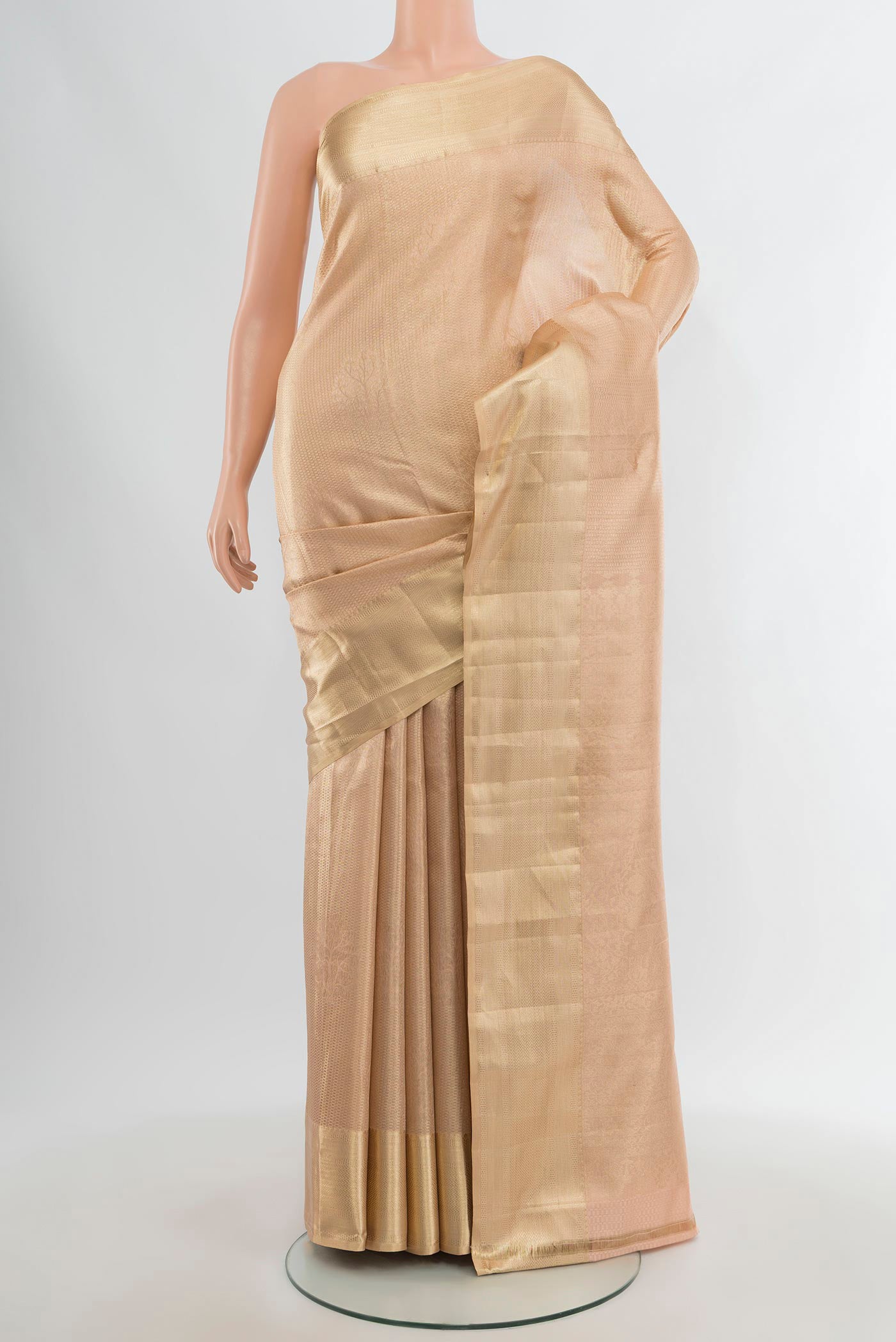 Rose Gold Kanjivaram Silk Saree with Zari Brocade on the body and Zari Border.  displayed on a mannequin