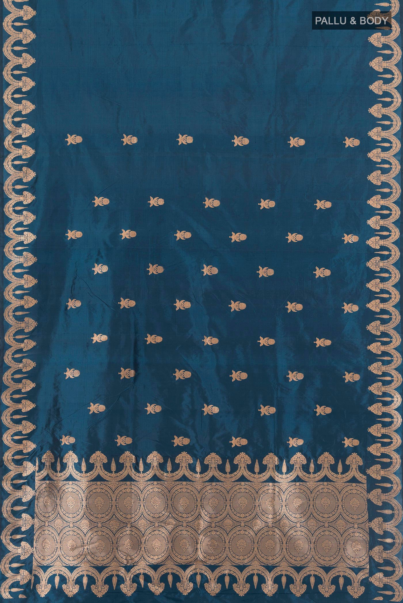 Flat view of Blue Banarasi Katan Silk Saree with Zari Butta on the body and Fancy Border. 