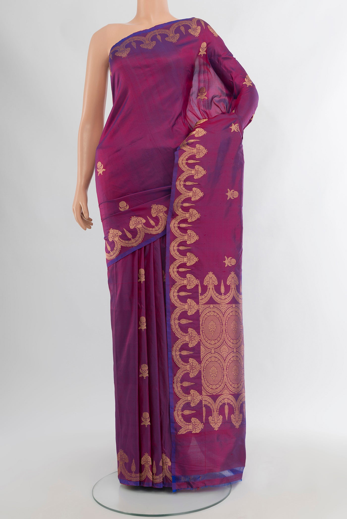 Purple Banarasi Katan Silk Saree with Zari Butta on the body and Fancy Border.  displayed on a mannequin