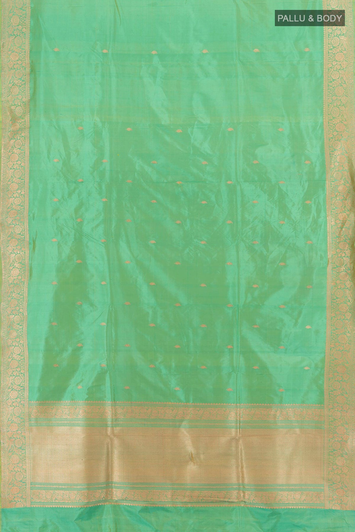 Flat view of Light Green Banarasi Katan Silk Saree with Zari Butta on the body and Zari Border. 