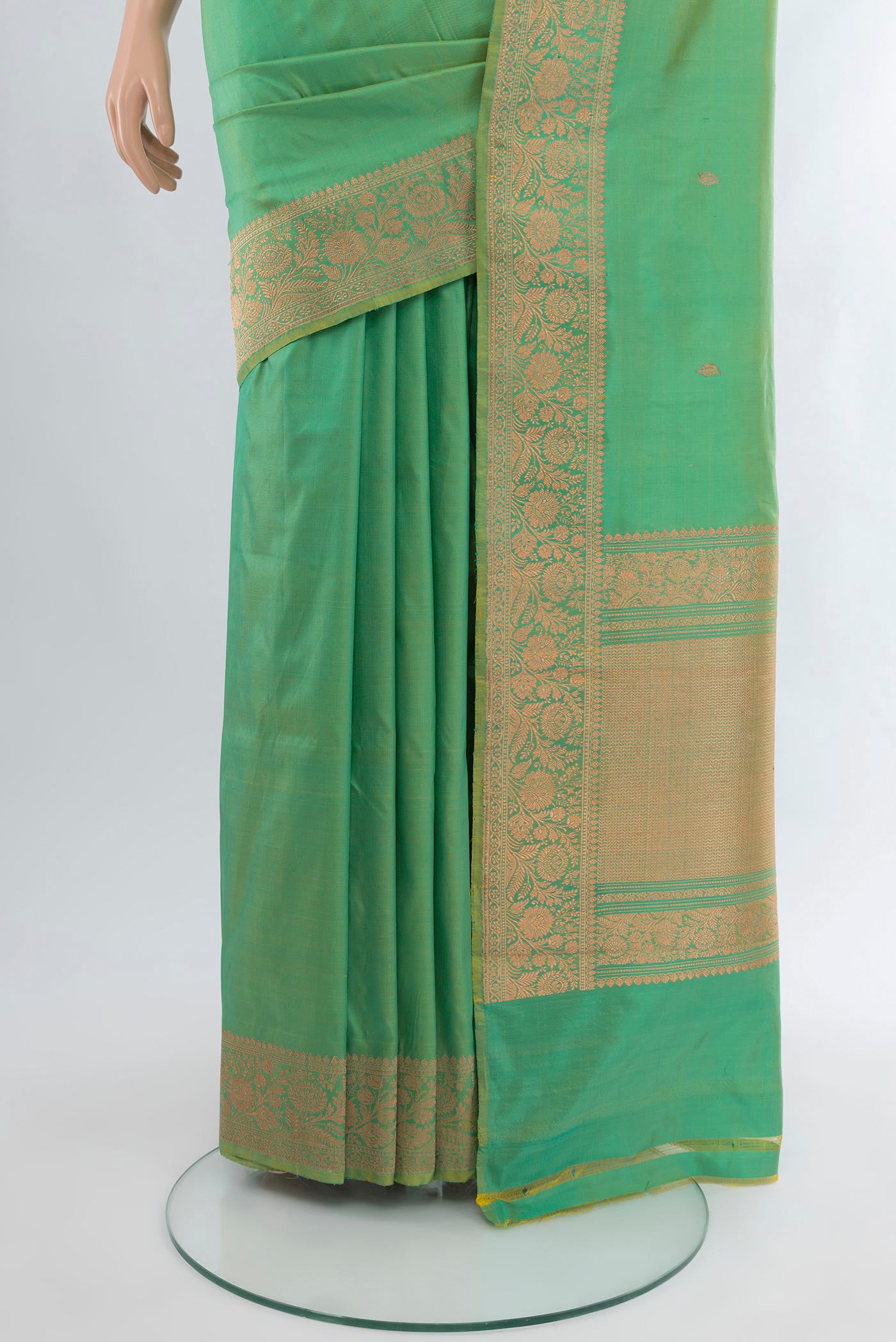 Pleats and pallu of Light Green Banarasi Katan Silk Saree with Zari Butta on the body and Zari Border. 