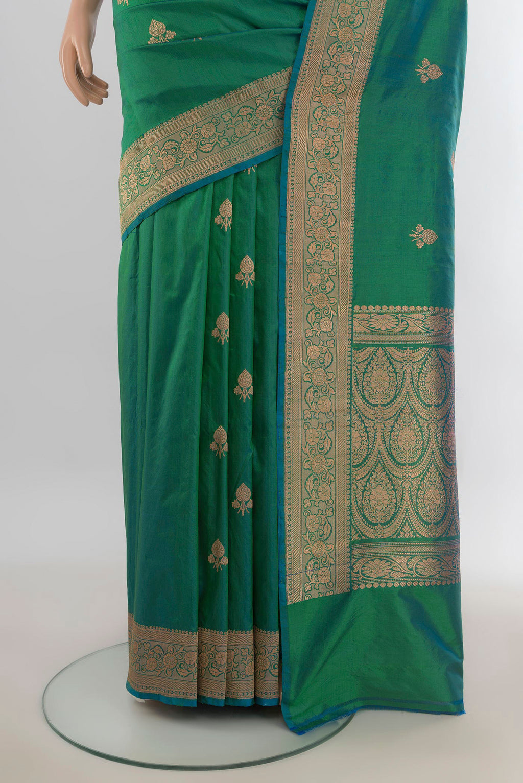 Pleats and pallu of Pure Silk Light Green Banarasi Katan Saree with Zari Butta on the body and Silk Border. 