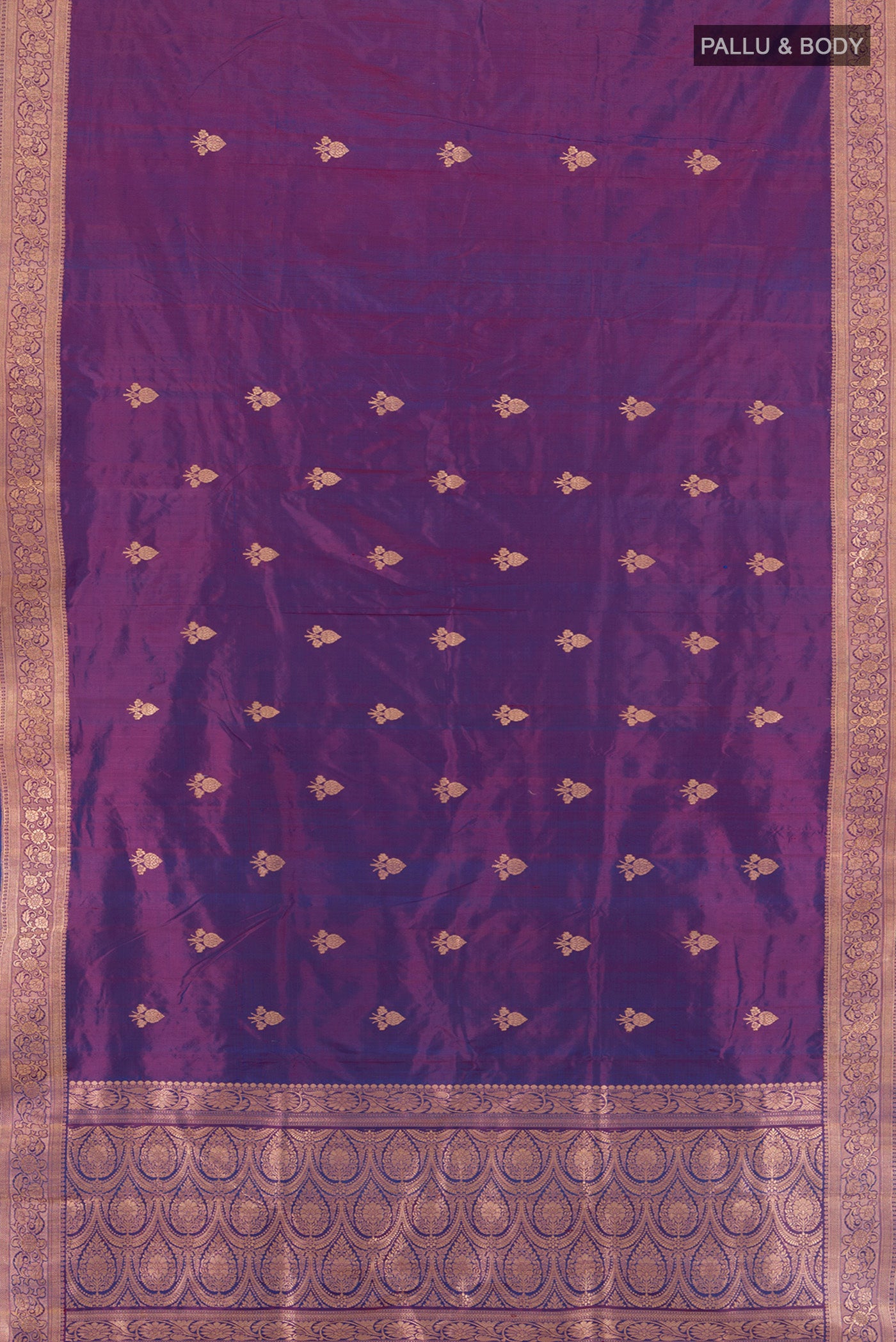 Flat view of Purple Banarasi Katan Silk Saree with Zari Butta on the body and Zari Border. 