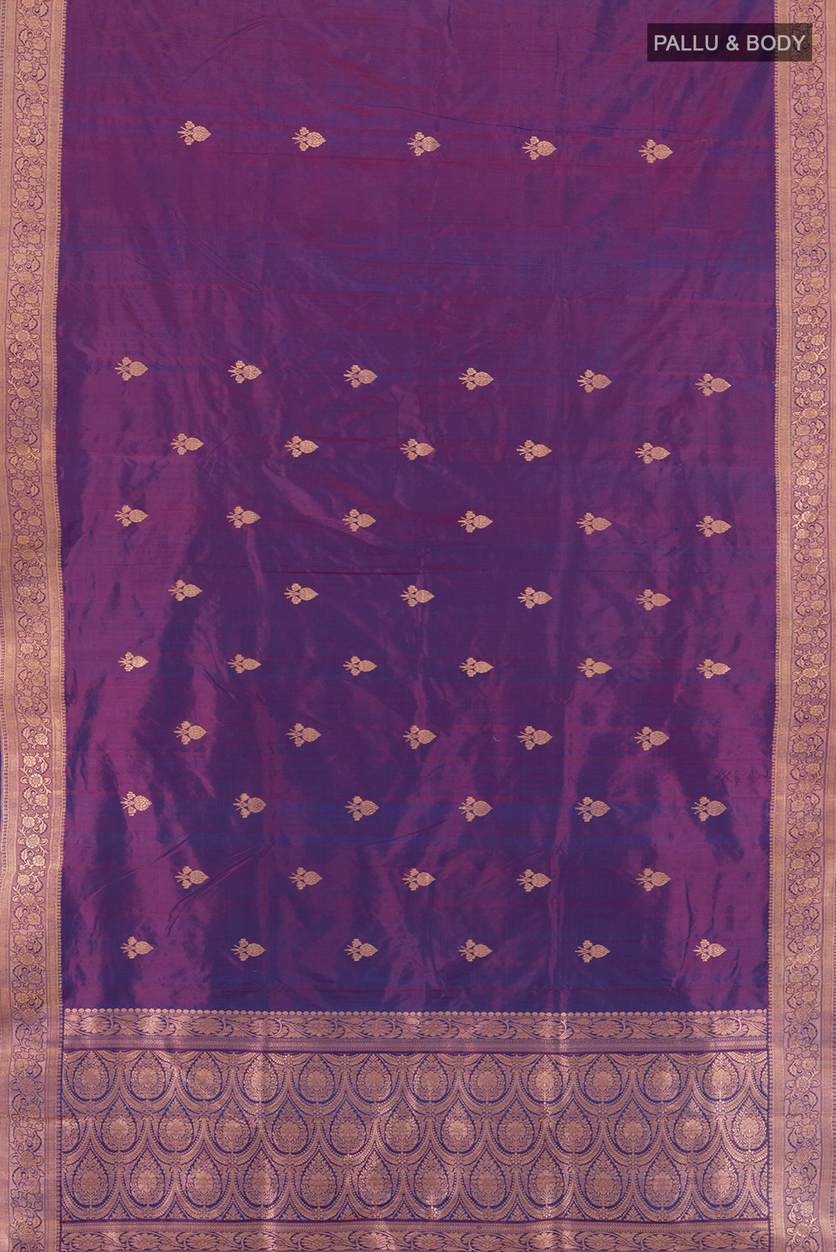 Flat view of Purple Banarasi Katan Silk Saree with Zari Butta on the body and Zari Border. 