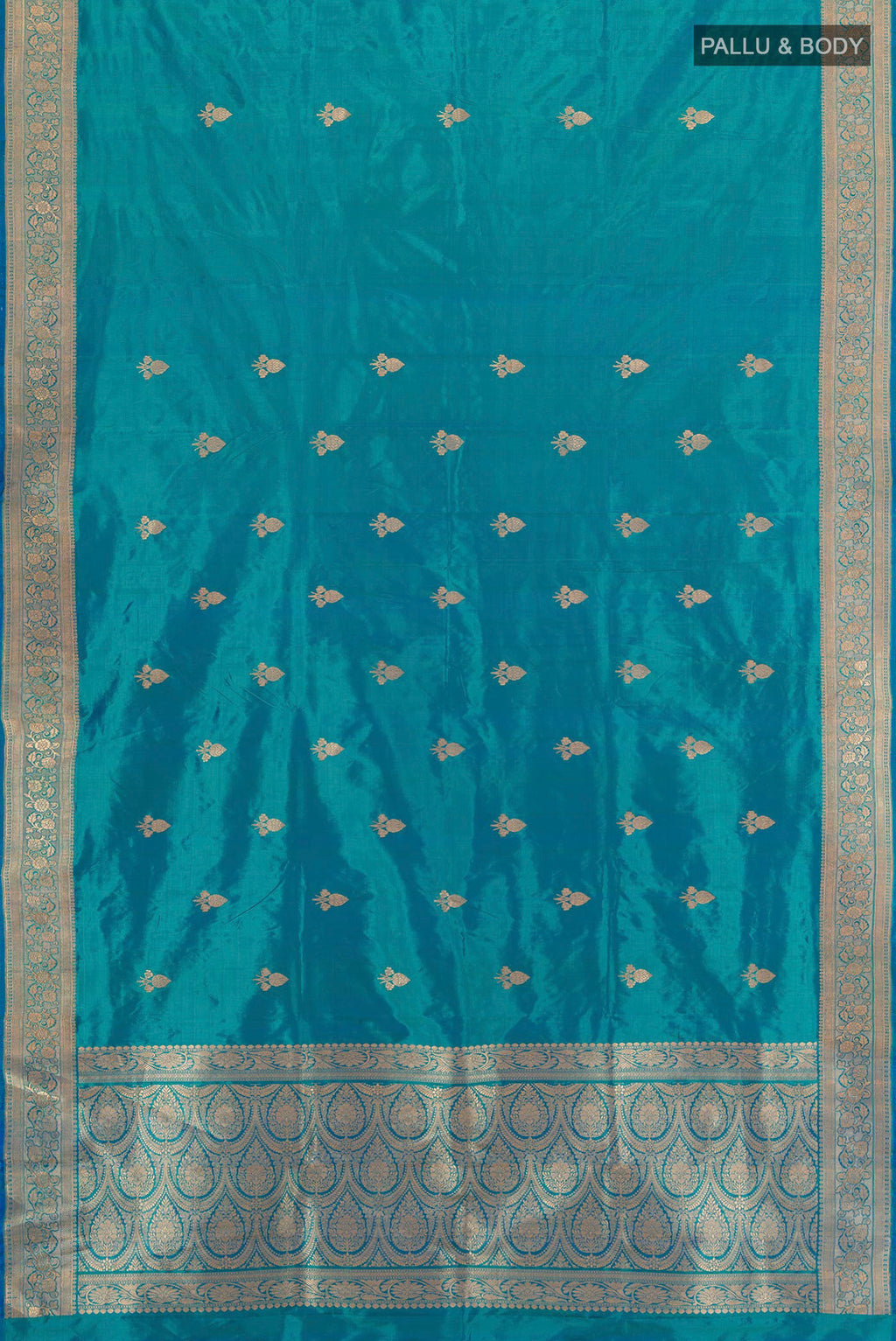 Flat view of Peacock Blue Banarasi Katan Silk Saree with Zari Butta on the body and Zari Border. 