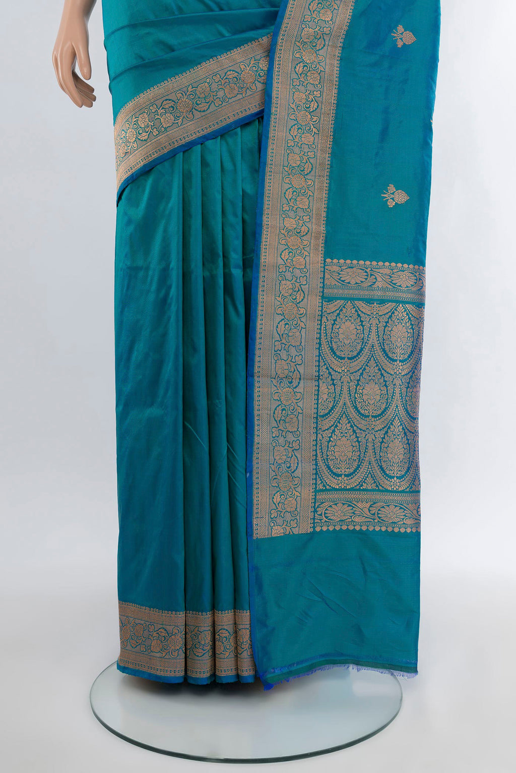 Pleats and pallu of Peacock Blue Banarasi Katan Silk Saree with Zari Butta on the body and Zari Border. 