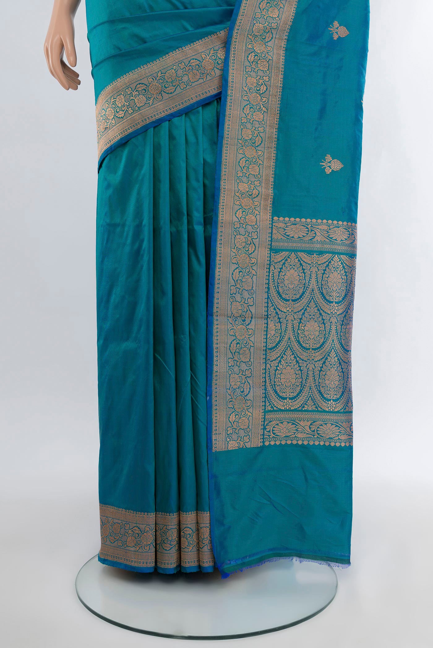 Pleats and pallu of Peacock Blue Banarasi Katan Silk Saree with Zari Butta on the body and Zari Border. 