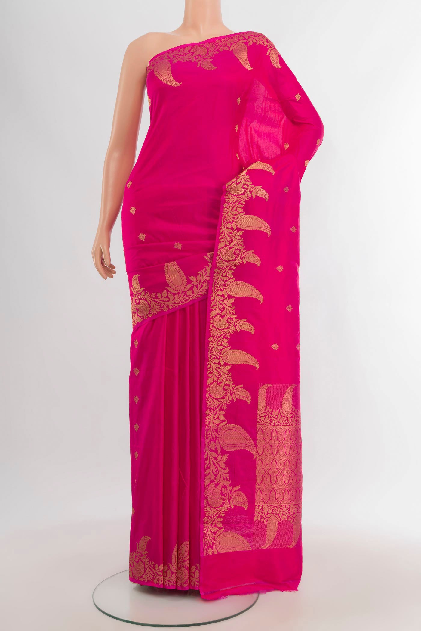 Rani Pink Banarasi Katan Silk Saree with Zari Butta on the body and Fancy Border.  displayed on a mannequin