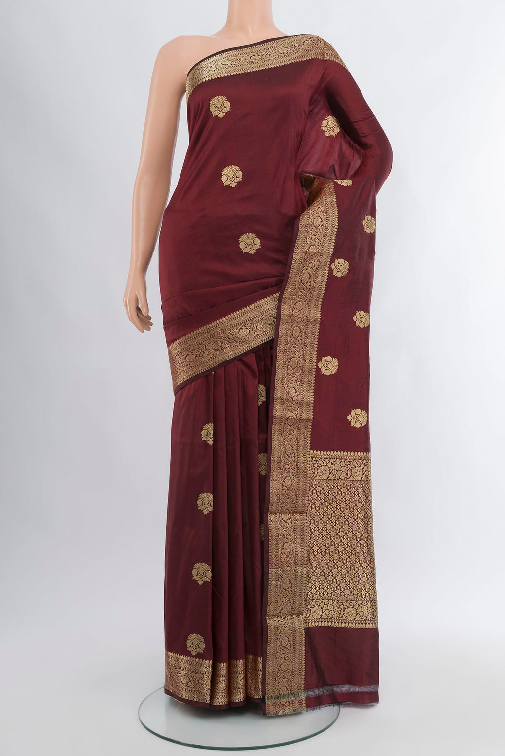 Coffee Brown Banarasi Katan Silk Saree with Zari Butta on the body and Zari Border.  displayed on a mannequin