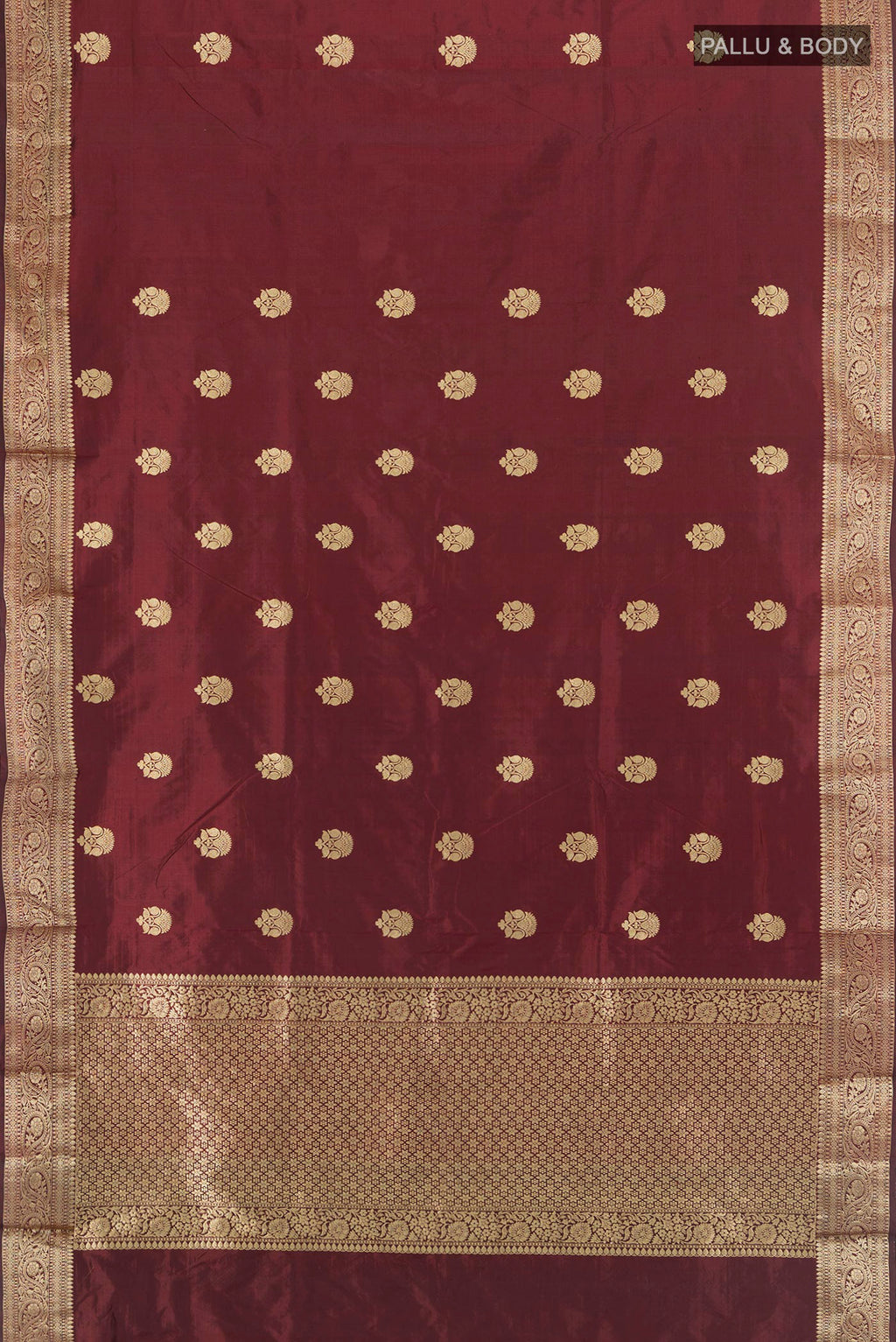 Flat view of Coffee Brown Banarasi Katan Silk Saree with Zari Butta on the body and Zari Border. 