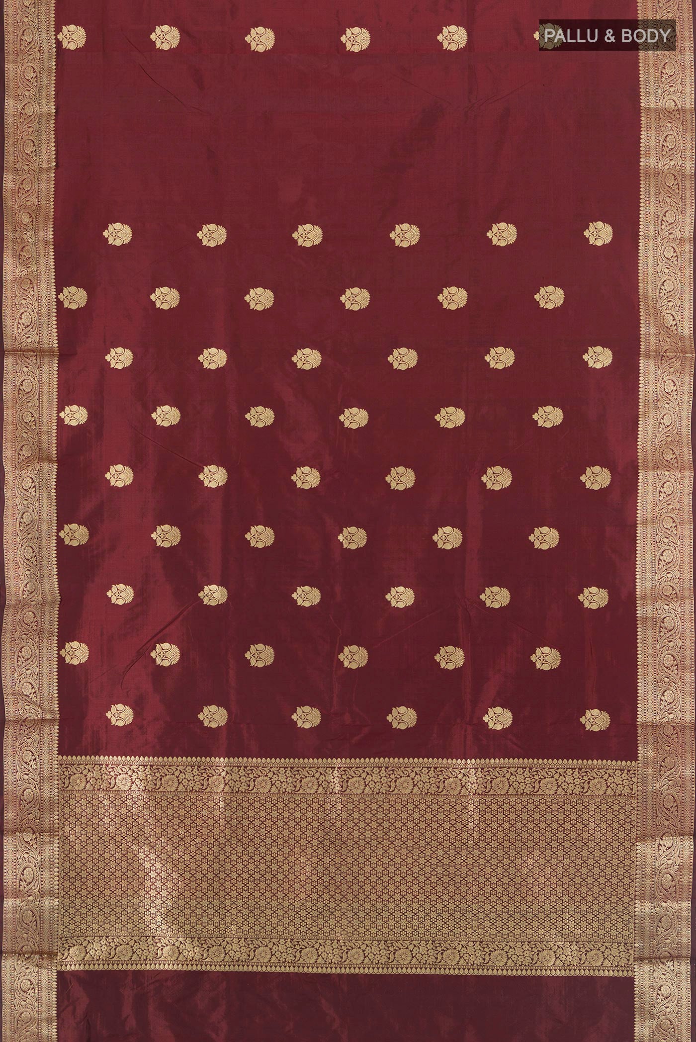 Flat view of Coffee Brown Banarasi Katan Silk Saree with Zari Butta on the body and Zari Border. 