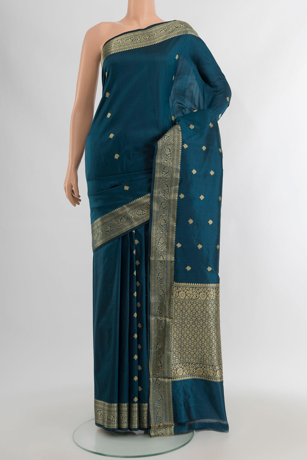 Blue Banarasi Katan Silk Saree with Zari Butta on the body and Zari Border.  displayed on a mannequin