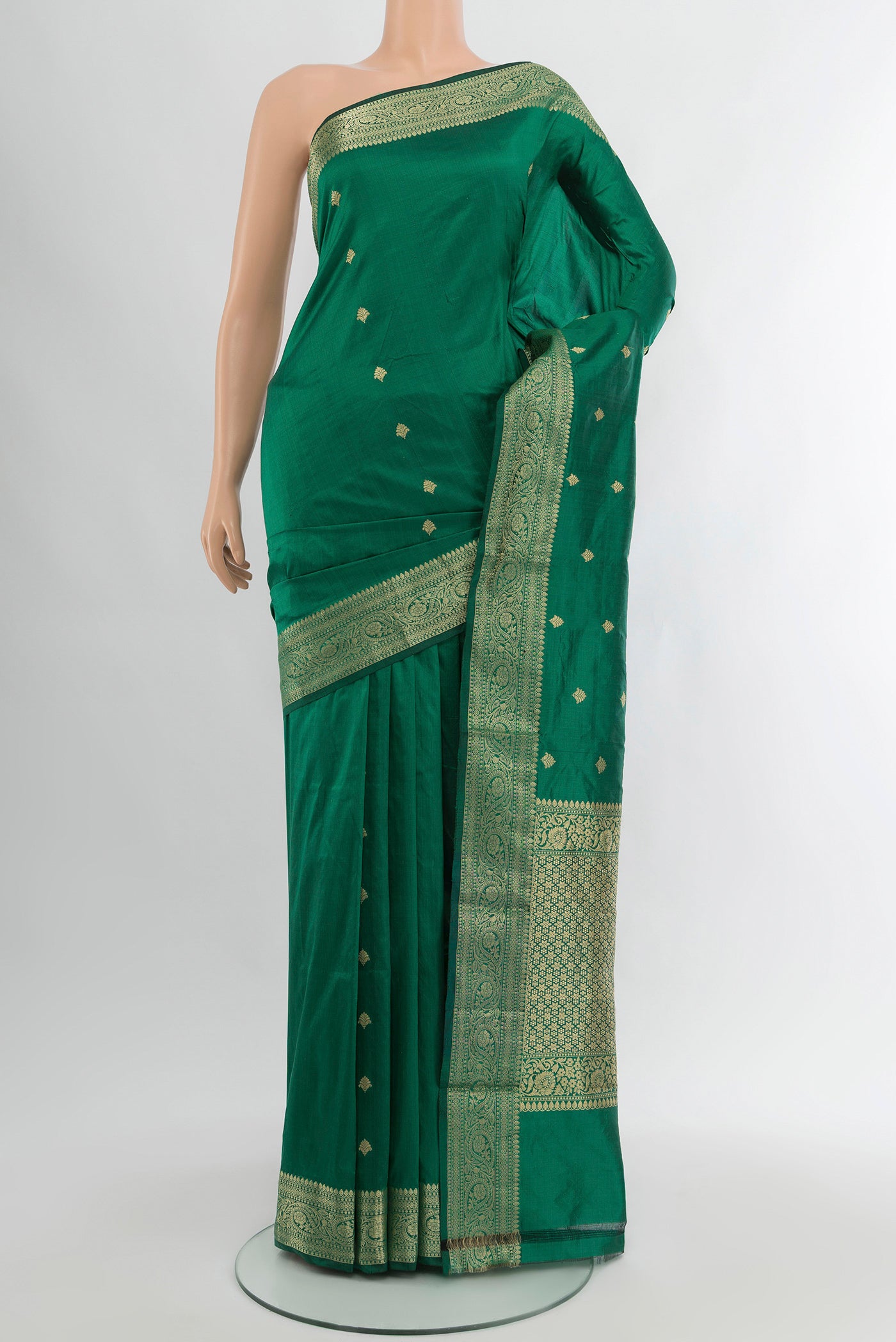 Green Banarasi Katan Silk Saree with Zari Butta on the body and Zari Border.  displayed on a mannequin