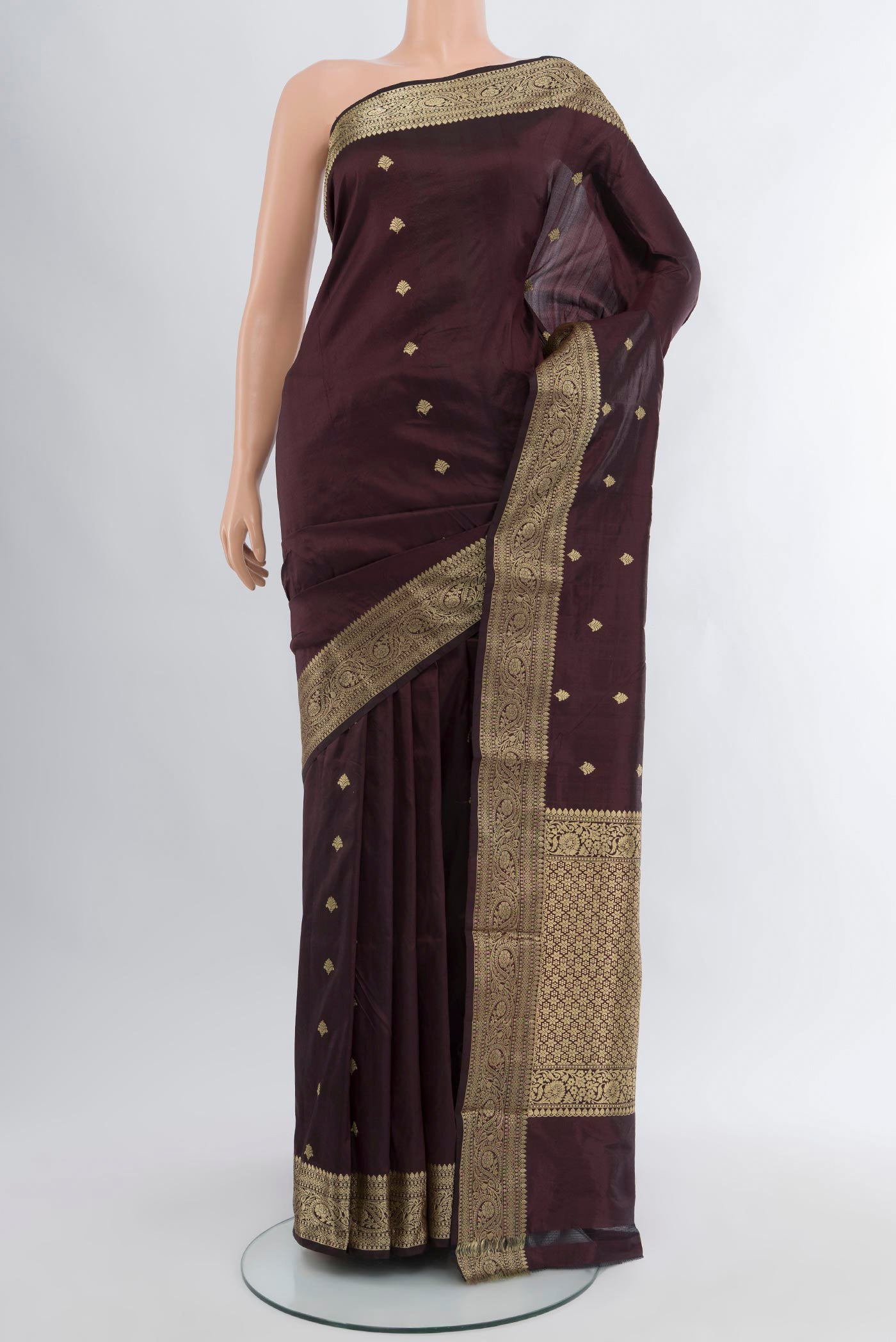Coffee Brown Banarasi Katan Silk Saree with Zari Butta on the body and Zari Border.  displayed on a mannequin