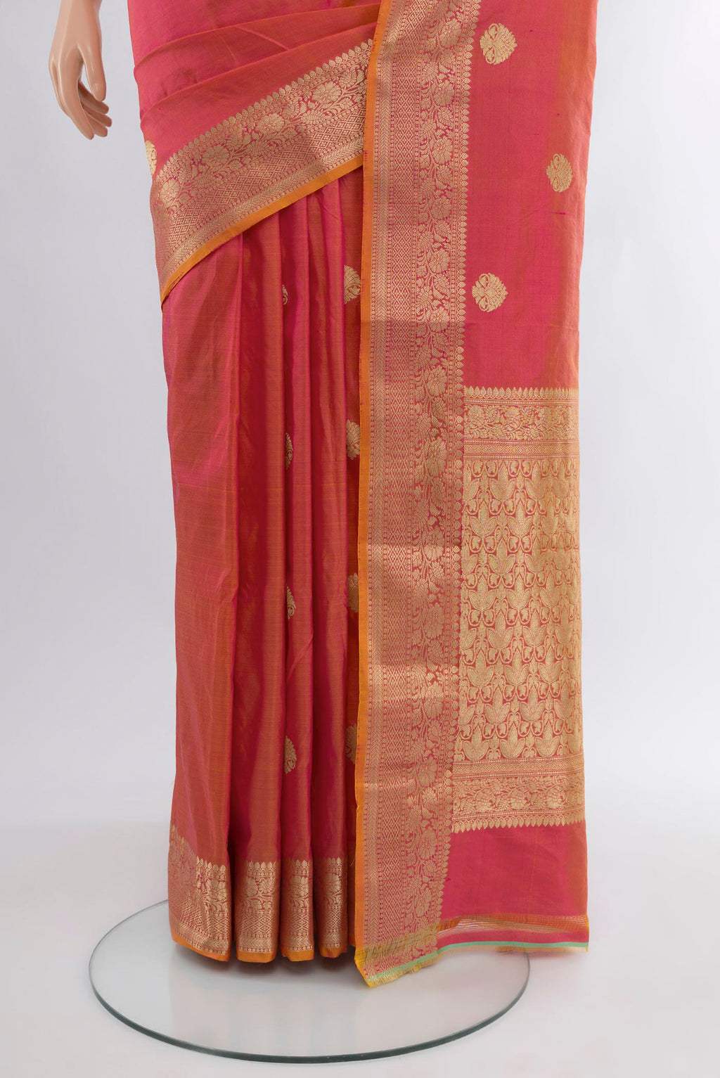 Pleats and pallu of Pinkish Yellow Banarasi Katan Silk Saree with Zari Butta on the body and Zari Border. 
