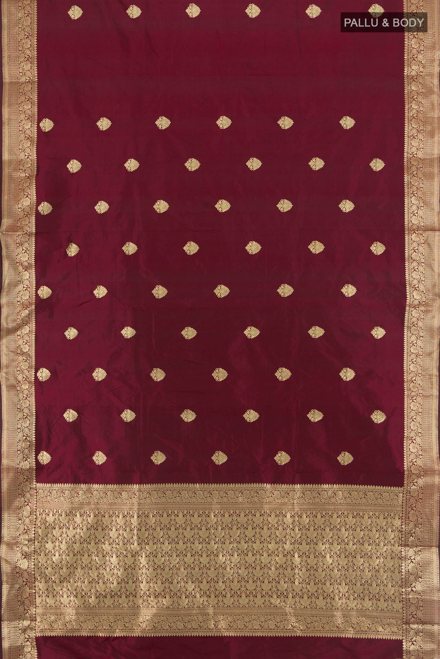 Flat view of Maroon Banarasi Katan Silk Saree with Zari Butta on the body and Zari Border. 