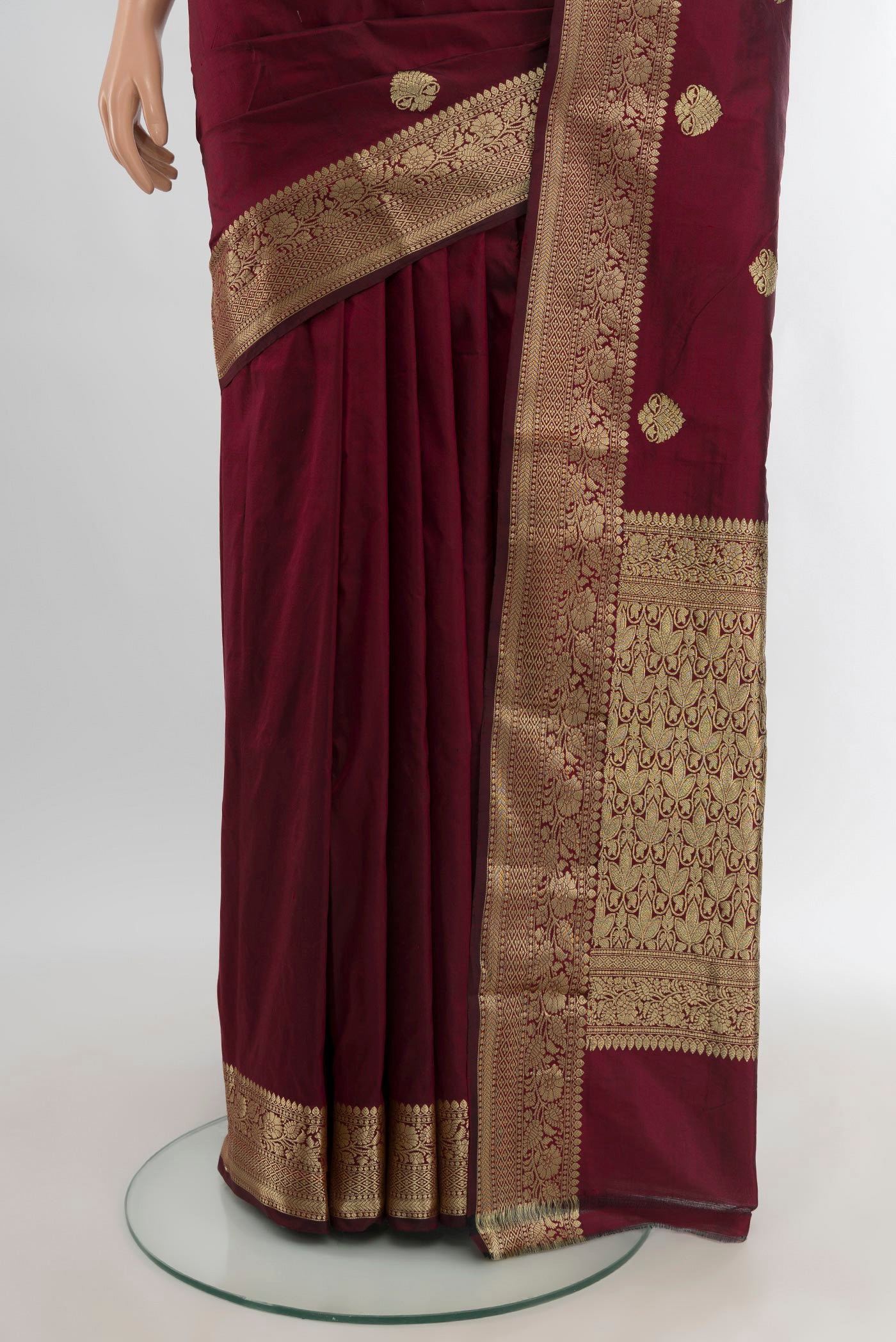 Pleats and pallu of Maroon Banarasi Katan Silk Saree with Zari Butta on the body and Zari Border. 