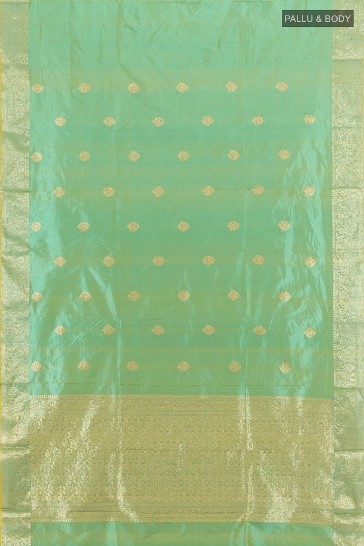 Flat view of Pure Silk Light Green Banarasi Katan Saree with Zari Butta on the body and Zari Border. 