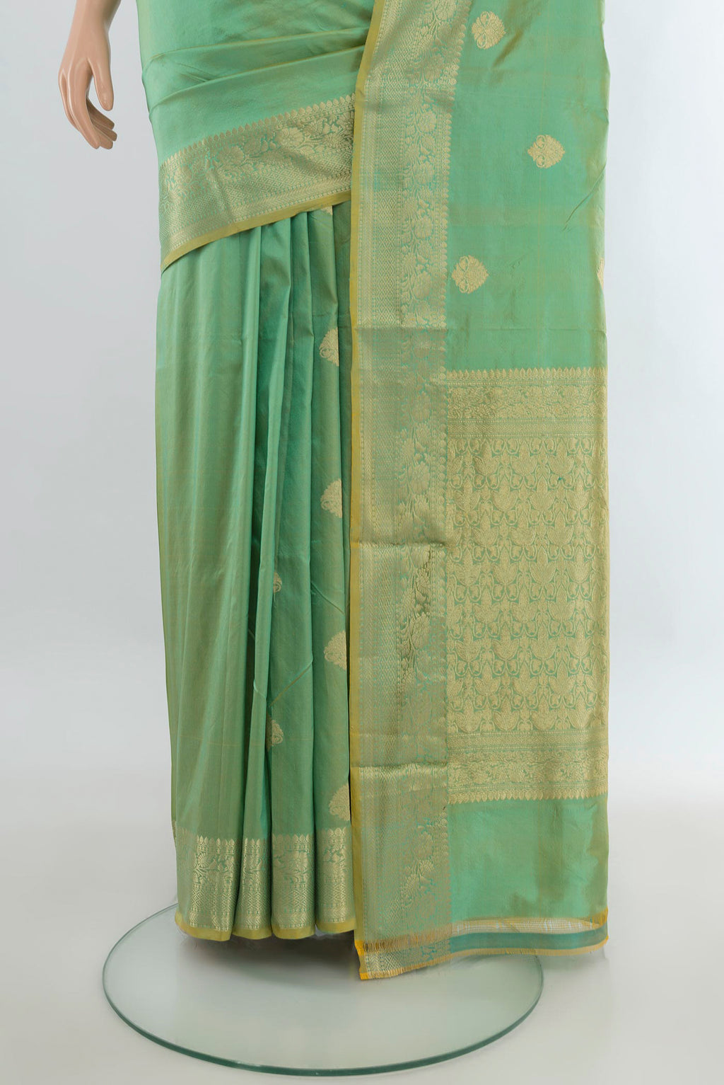 Pleats and pallu of Pure Silk Light Green Banarasi Katan Saree with Zari Butta on the body and Zari Border. 