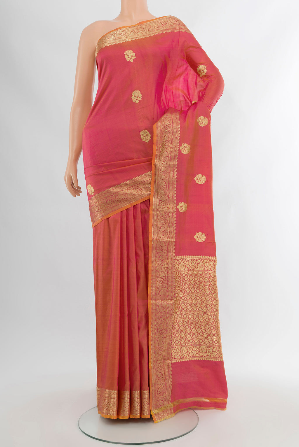 Rose pink Banarasi Katan Silk Saree with Zari Butta on the body and Silk Border.  displayed on a mannequin