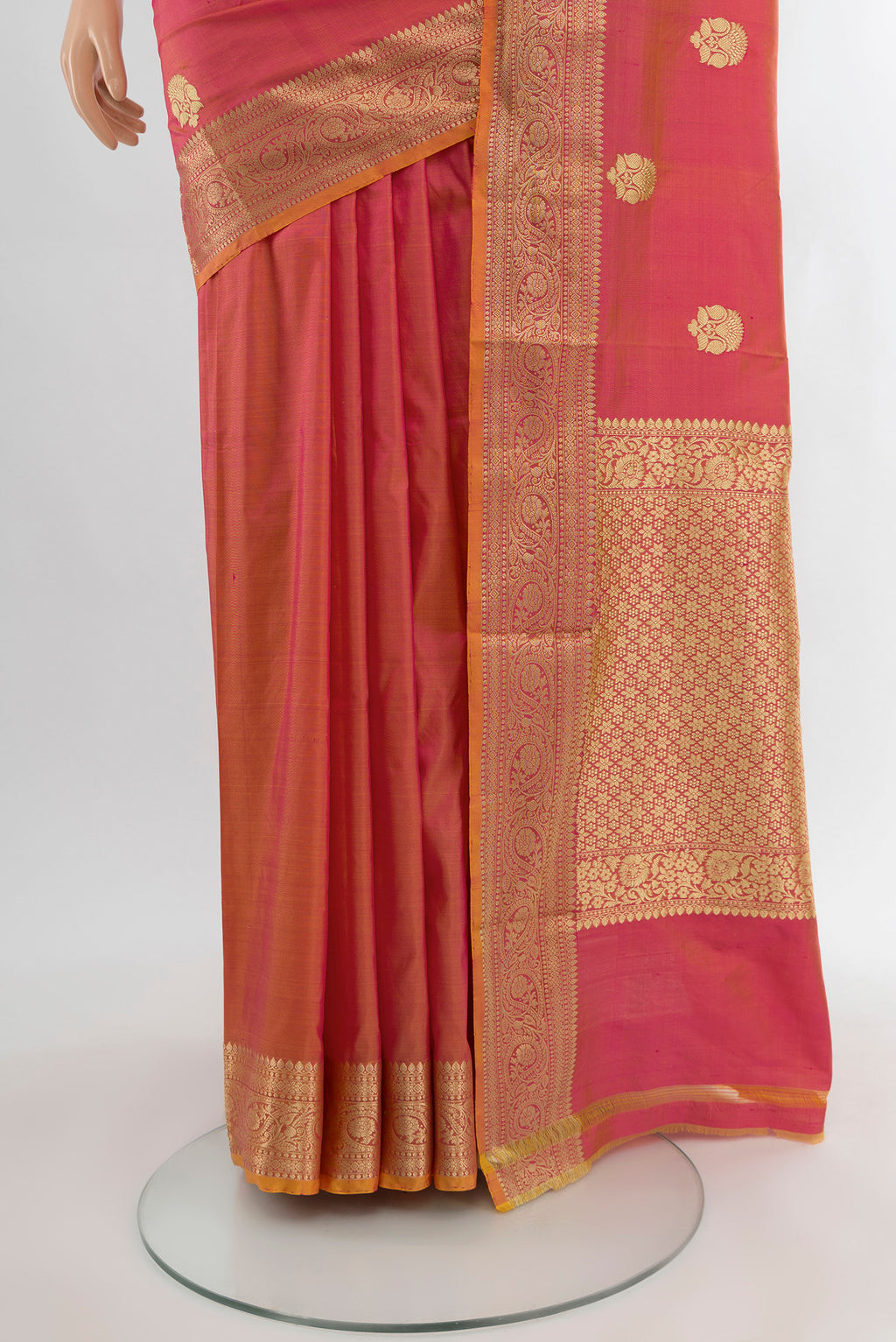 Pleats and pallu of Rose pink Banarasi Katan Silk Saree with Zari Butta on the body and Silk Border. 