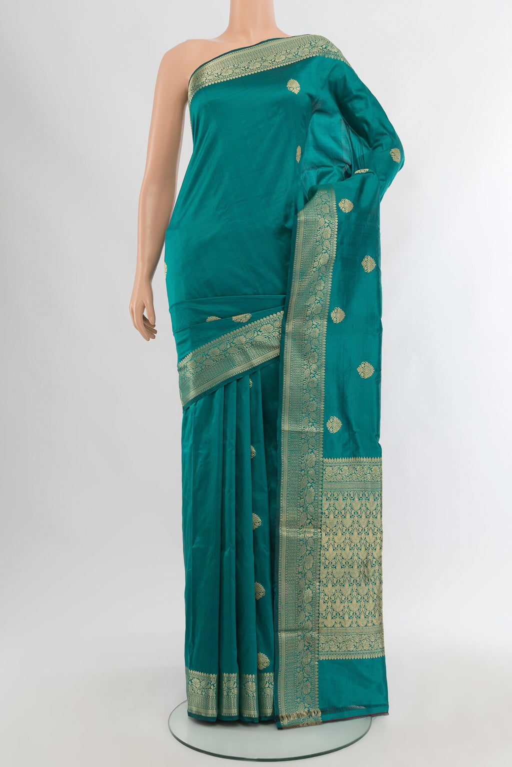 Teal Banarasi Katan Silk Saree with Zari Butta on the body and Zari Border.  displayed on a mannequin