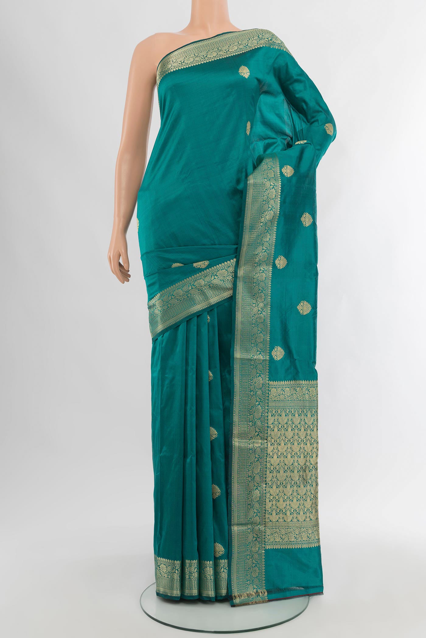 Teal Banarasi Katan Silk Saree with Zari Butta on the body and Zari Border.  displayed on a mannequin