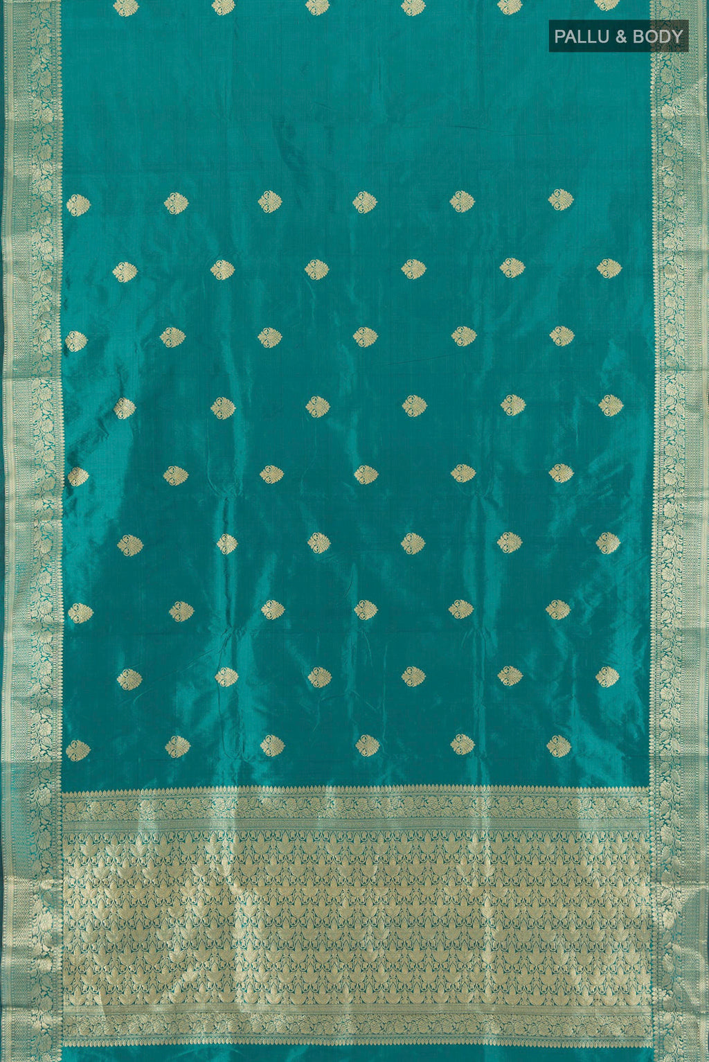 Flat view of Teal Banarasi Katan Silk Saree with Zari Butta on the body and Zari Border. 