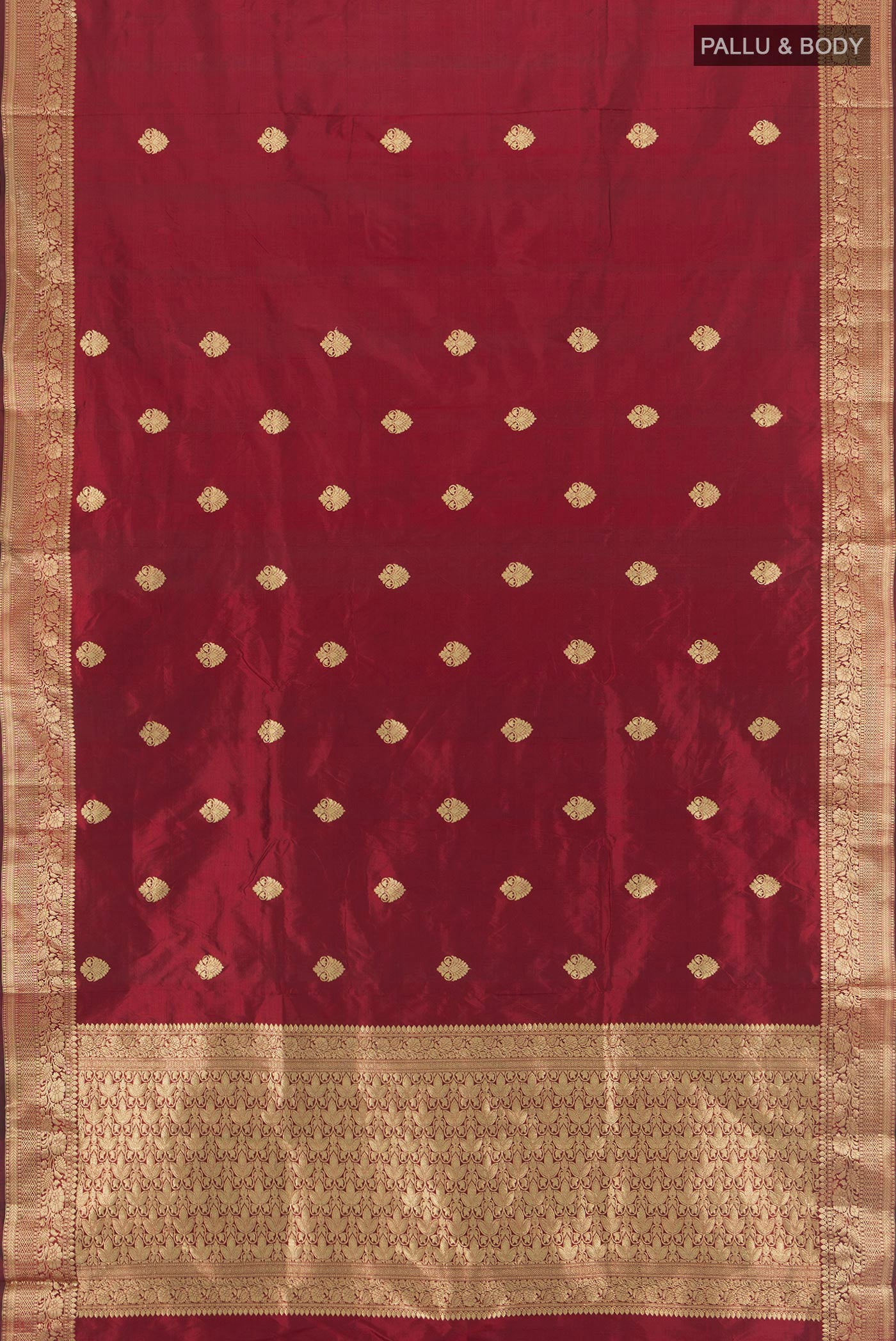 Flat view of Maroon Banarasi Katan Silk Saree with Zari Butta on the body and Zari Border. 