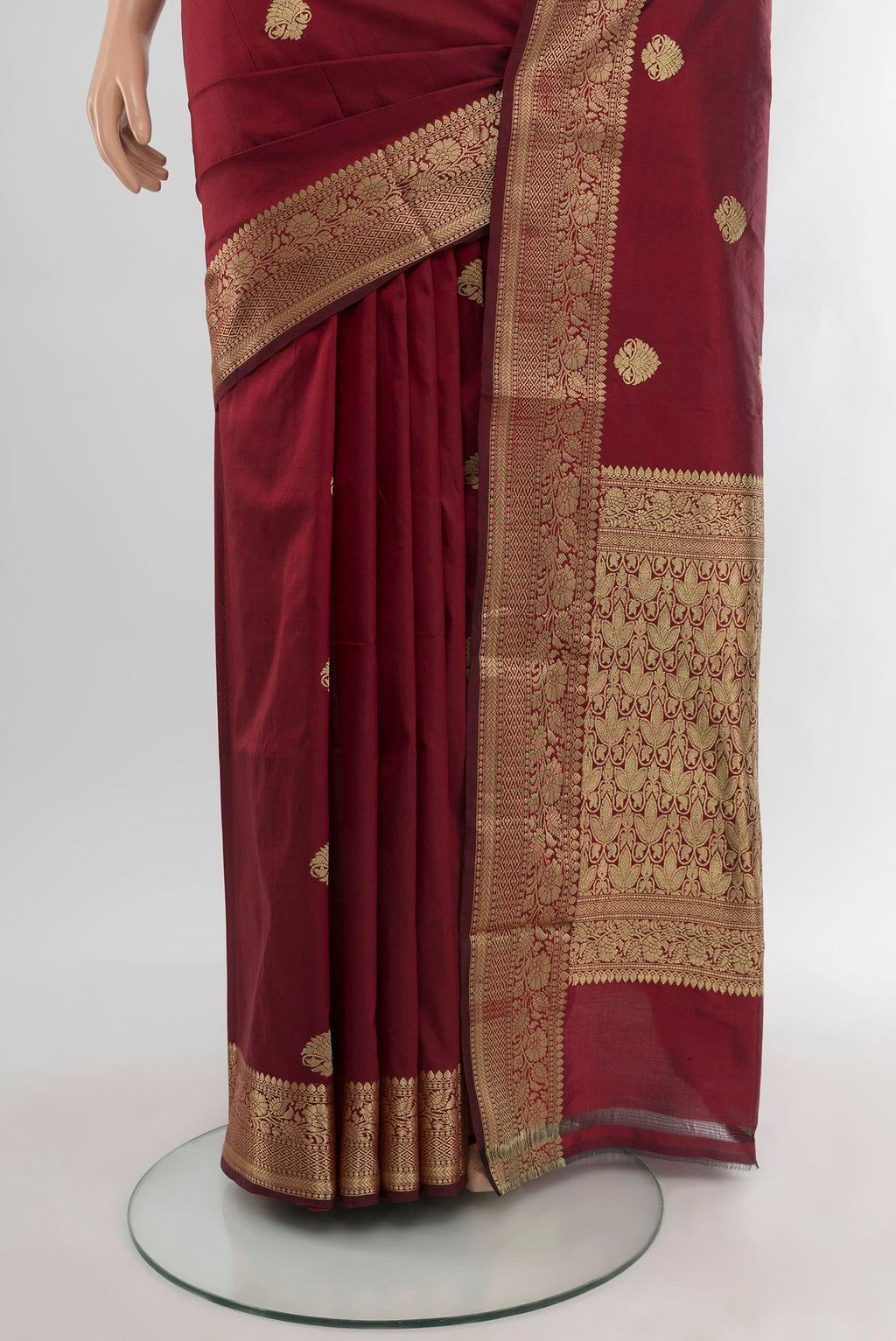 Pleats and pallu of Maroon Banarasi Katan Silk Saree with Zari Butta on the body and Zari Border. 