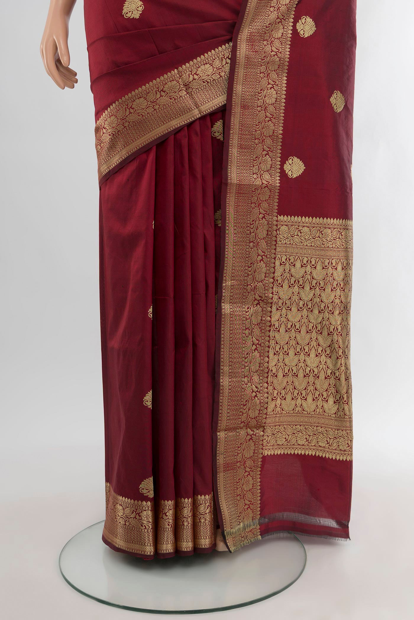 Pleats and pallu of Maroon Banarasi Katan Silk Saree with Zari Butta on the body and Zari Border. 