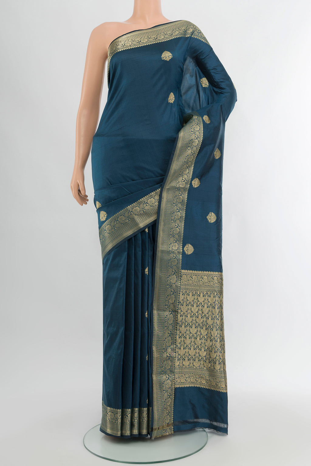 Blue Banarasi Katan Silk Saree with Zari Butta on the body and Zari Border.  displayed on a mannequin