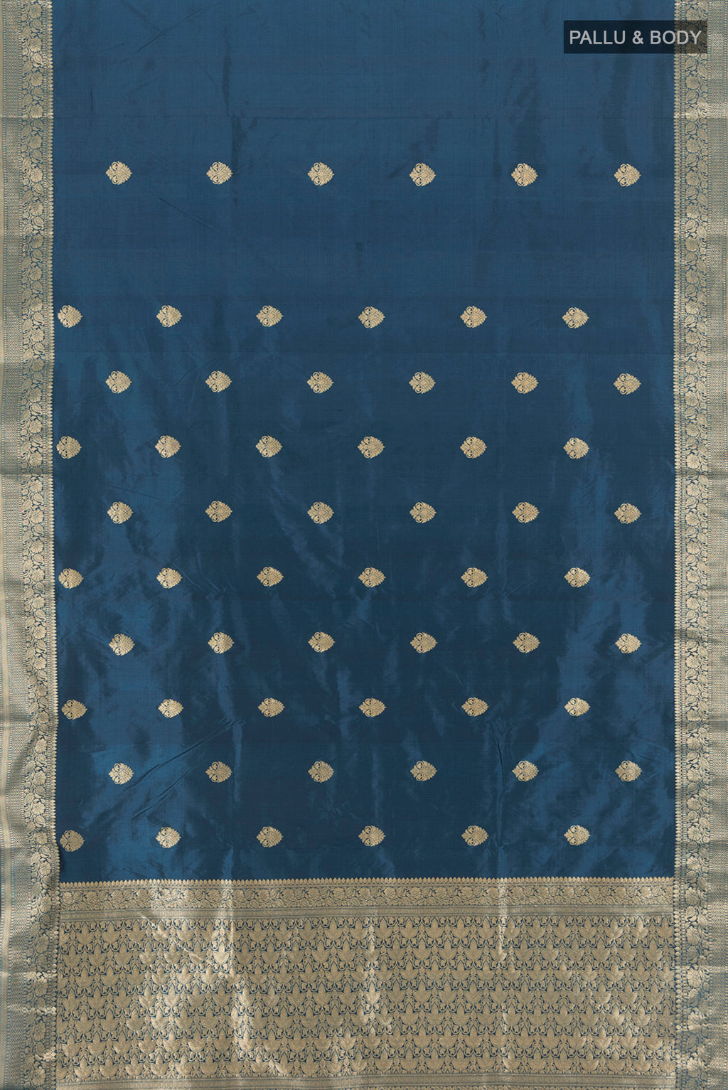 Flat view of Blue Banarasi Katan Silk Saree with Zari Butta on the body and Zari Border. 
