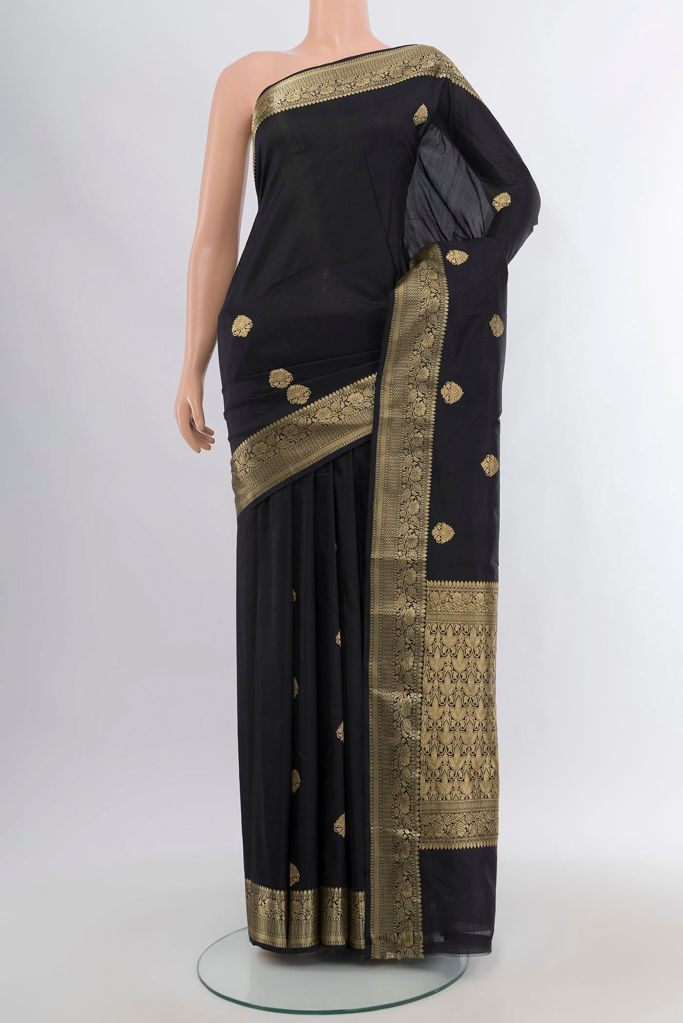 Black Banarasi Katan Silk Saree with Zari Butta on the body and Zari Border.  displayed on a mannequin
