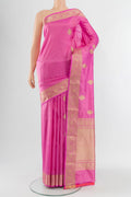 Rose pink Banarasi Katan Silk Saree with Zari Butta on the body and Zari Border.  displayed on a mannequin