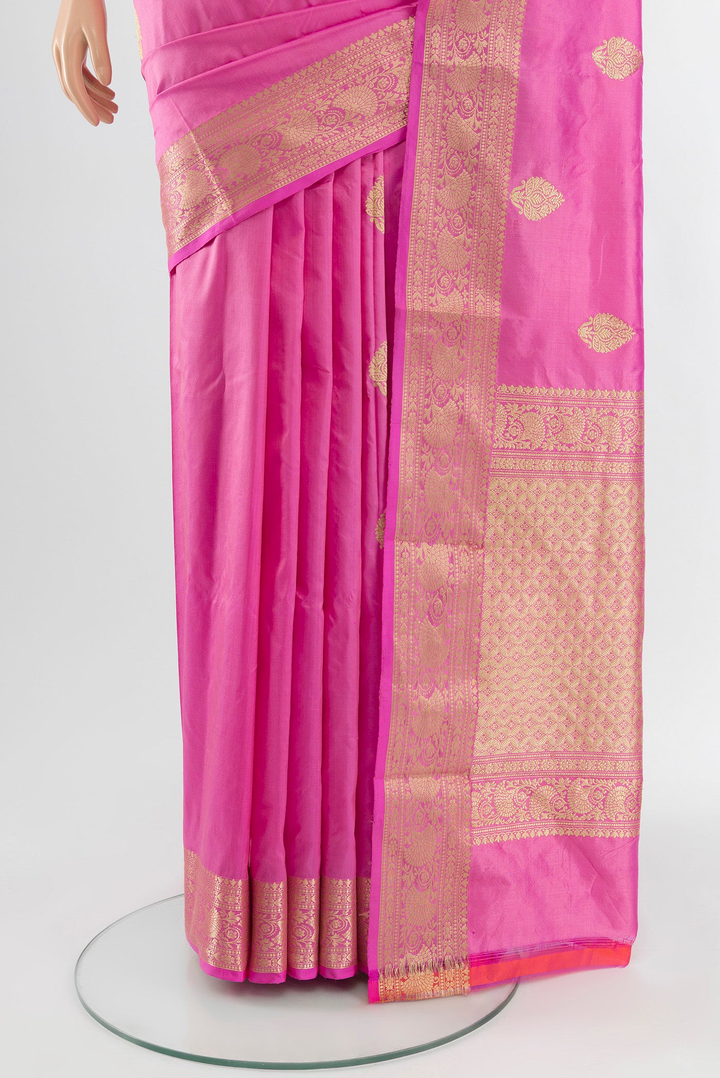 Pleats and pallu of Rose pink Banarasi Katan Silk Saree with Zari Butta on the body and Zari Border. 