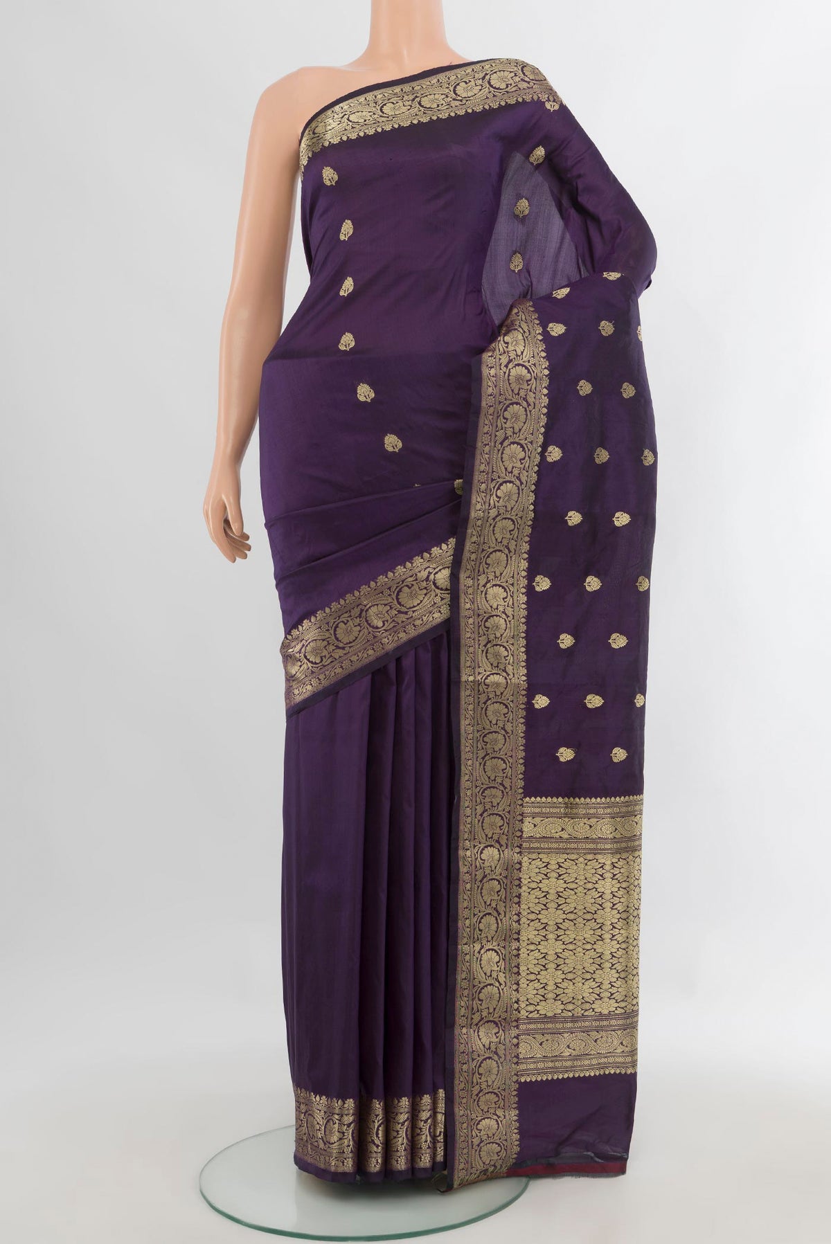 Pure Silk Violet Banarasi Katan Saree with Zari Butta on the body and Zari Border.  displayed on a mannequin