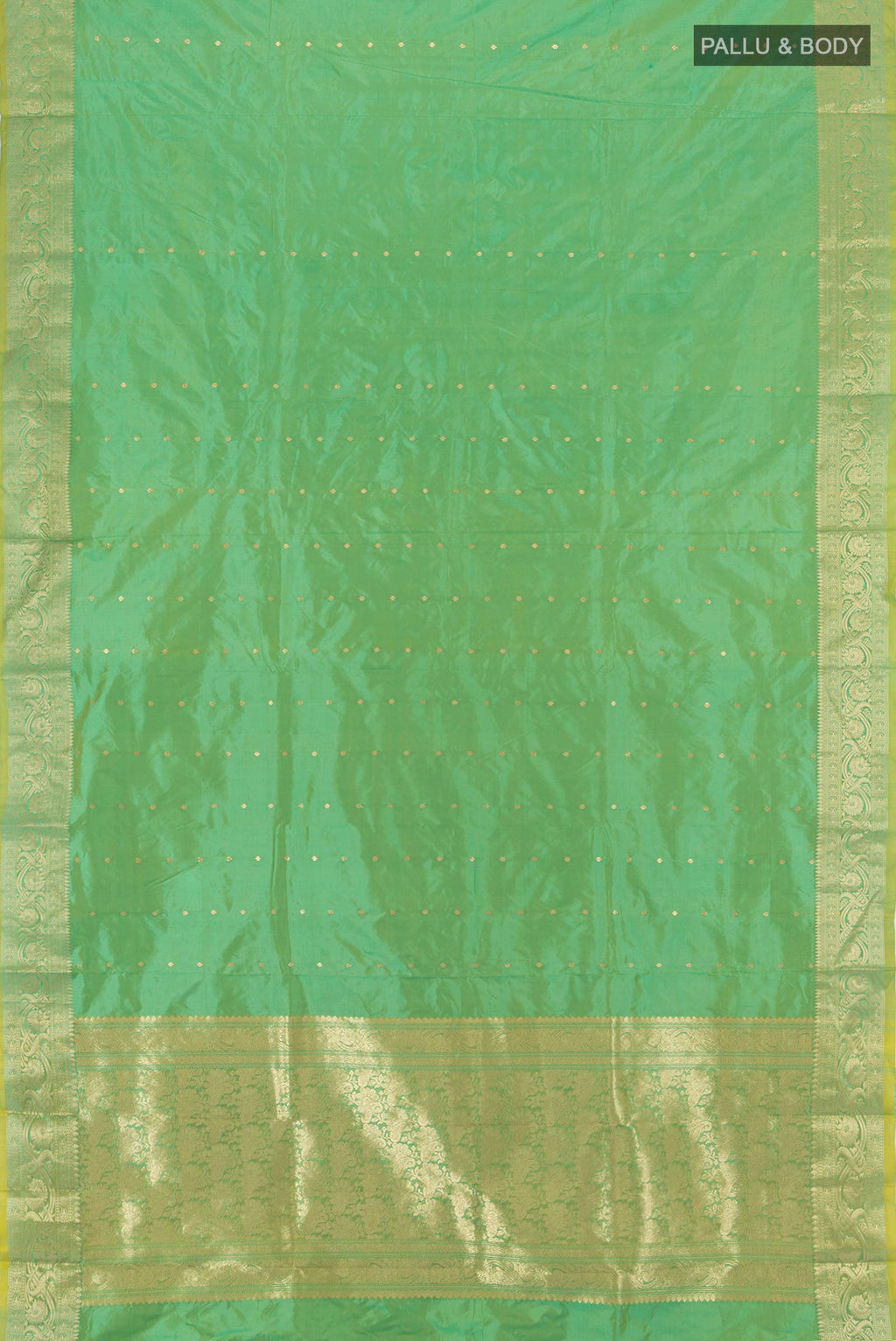 Flat view of Light Green Banarasi Katan Silk Saree with Zari Butta on the body and Zari Border. 