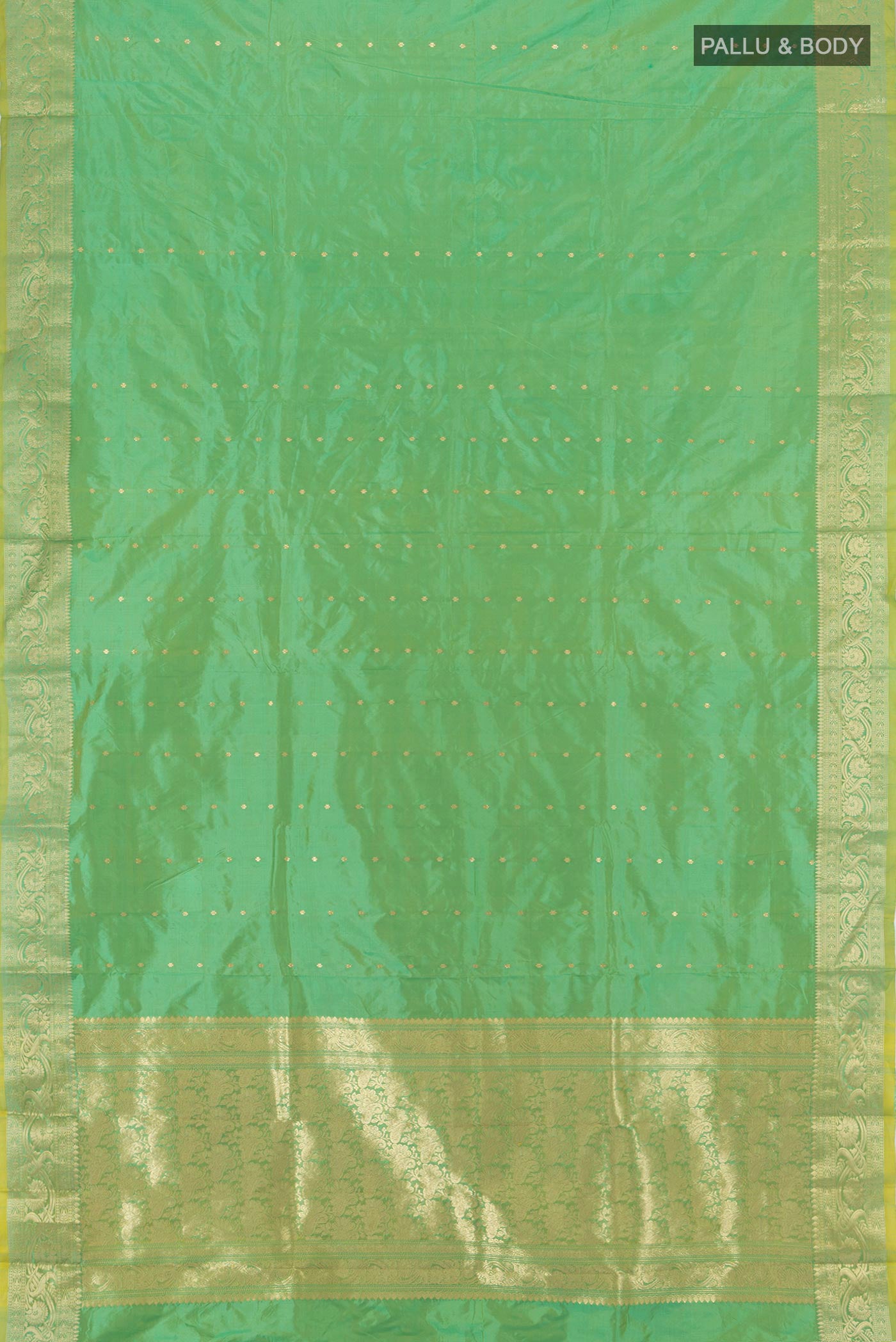 Flat view of Light Green Banarasi Katan Silk Saree with Zari Butta on the body and Zari Border. 