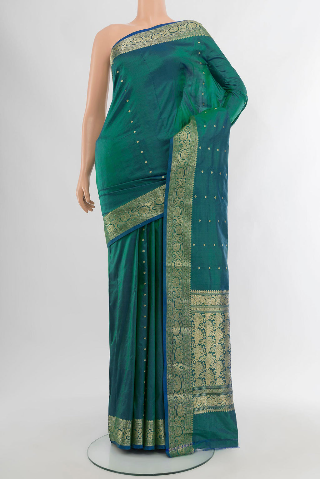 Peacock Blue Banarasi Katan Silk Saree with Zari Butta on the body and Zari Border.  displayed on a mannequin