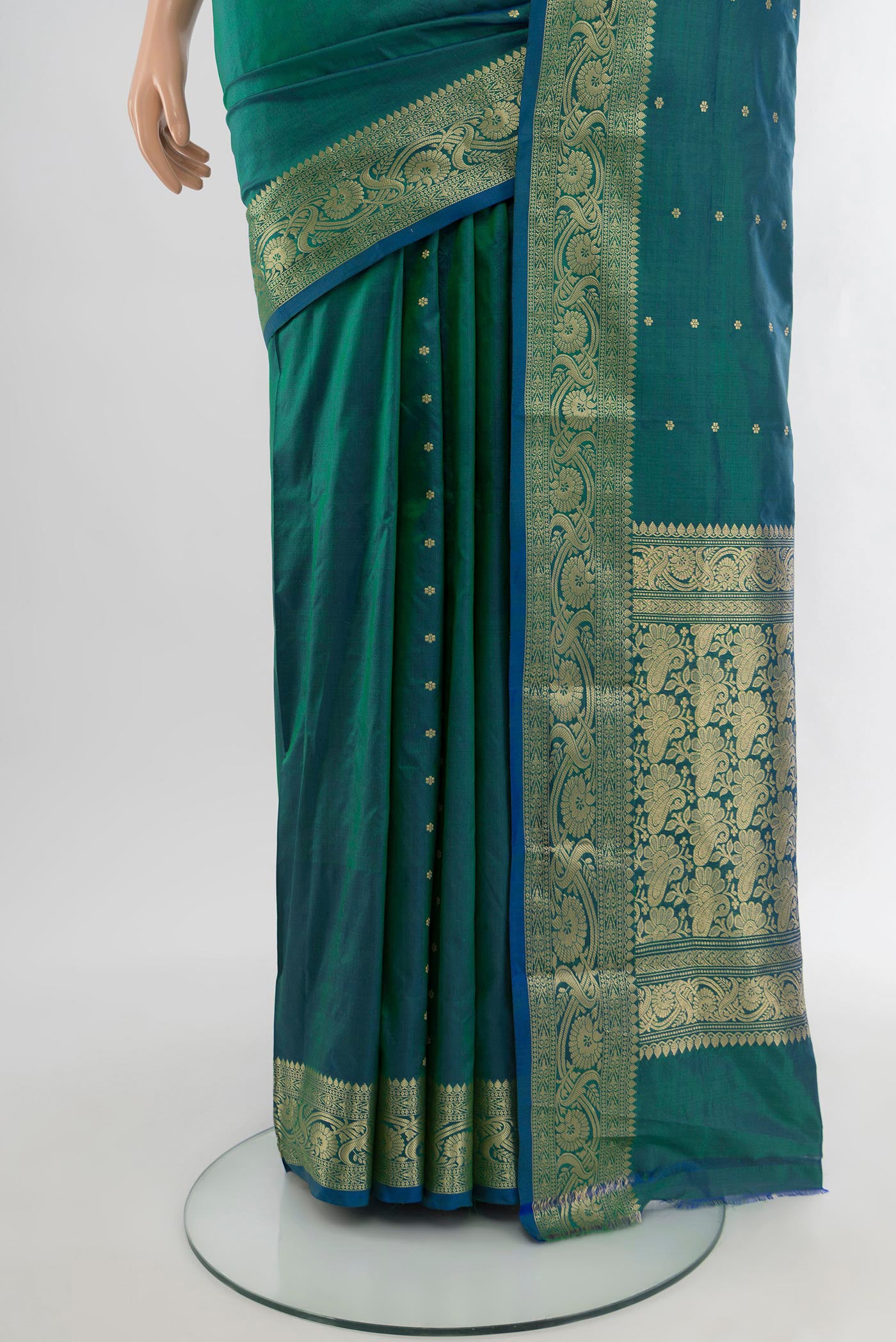 Pleats and pallu of Peacock Blue Banarasi Katan Silk Saree with Zari Butta on the body and Zari Border. 
