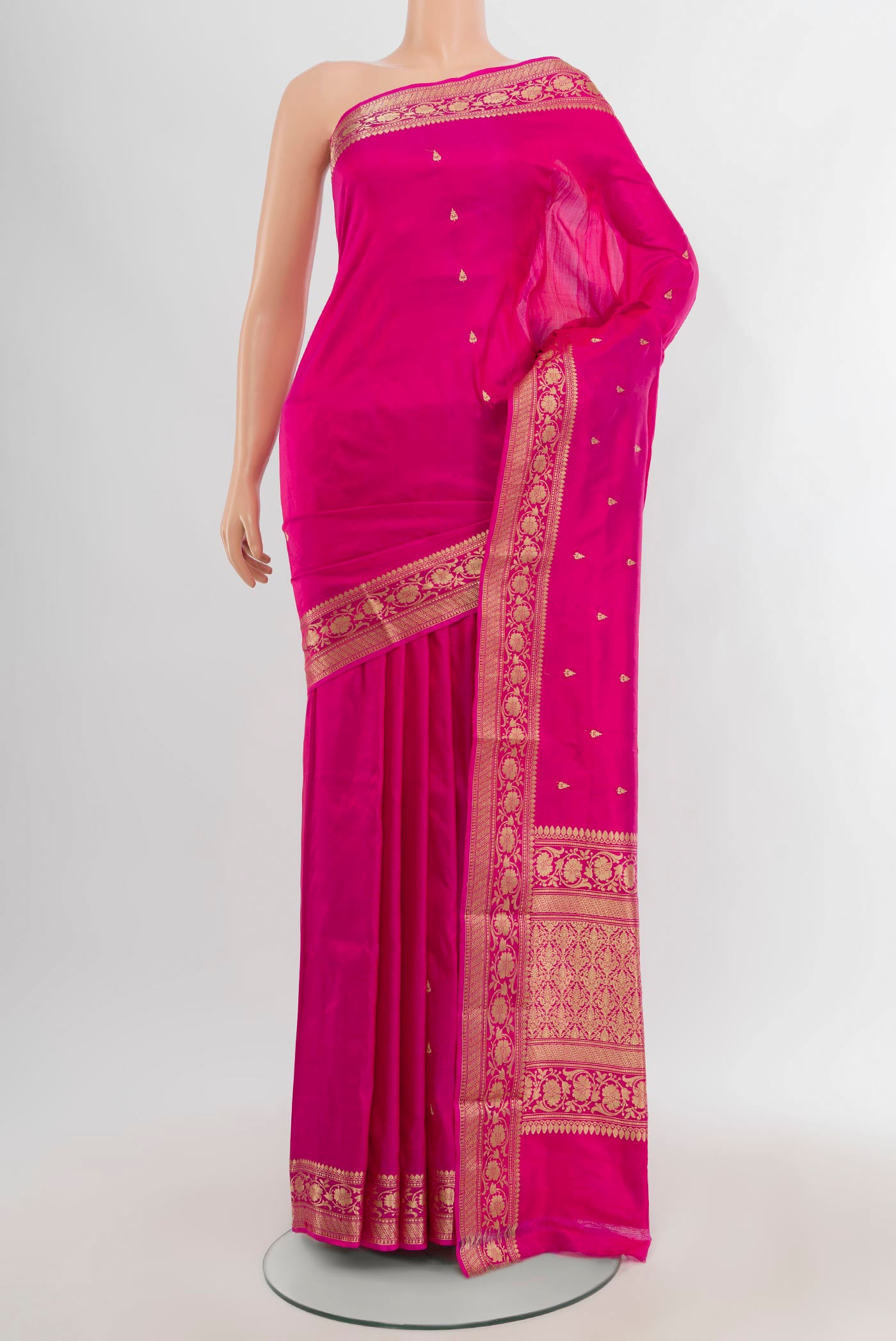 Dark Pink Banarasi Katan Silk Saree with Thread Butta on the body and Zari Border.  displayed on a mannequin