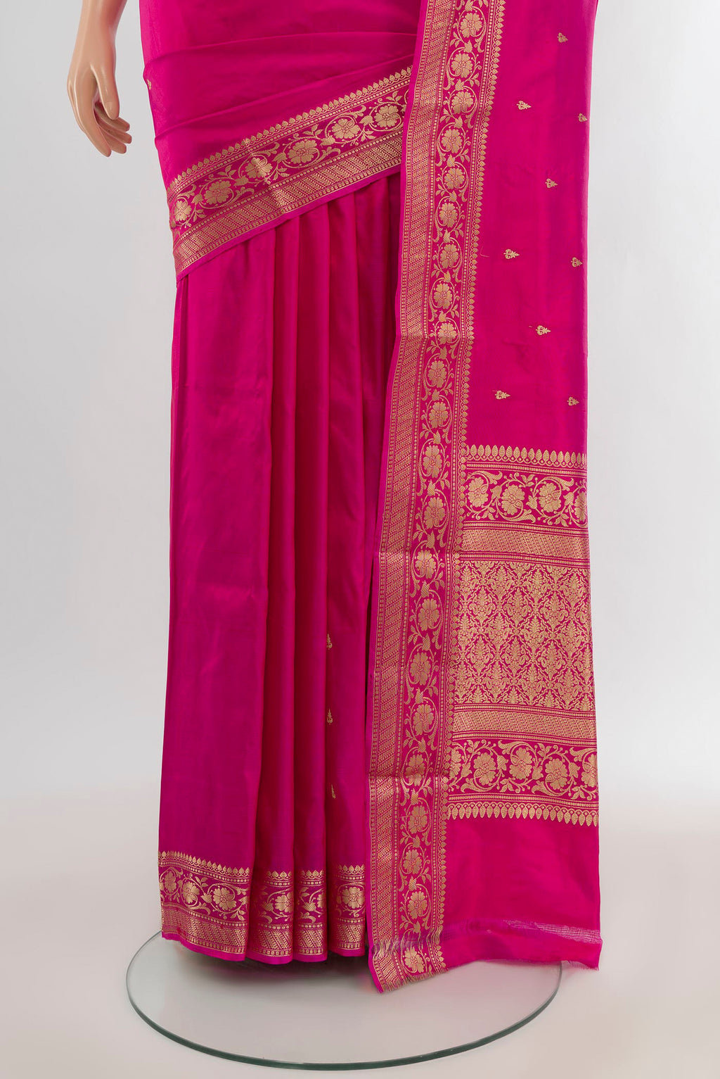 Pleats and pallu of Dark Pink Banarasi Katan Silk Saree with Thread Butta on the body and Zari Border. 