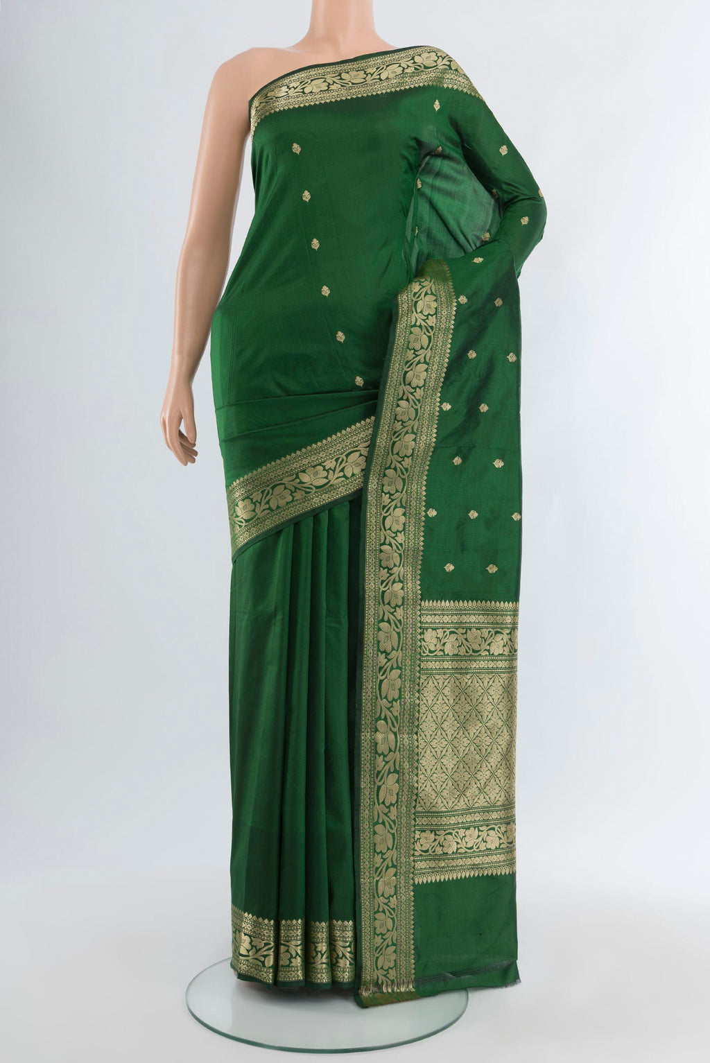 Bottle Green Banarasi Katan Silk Saree with Zari Butta on the body and Zari Border.  displayed on a mannequin