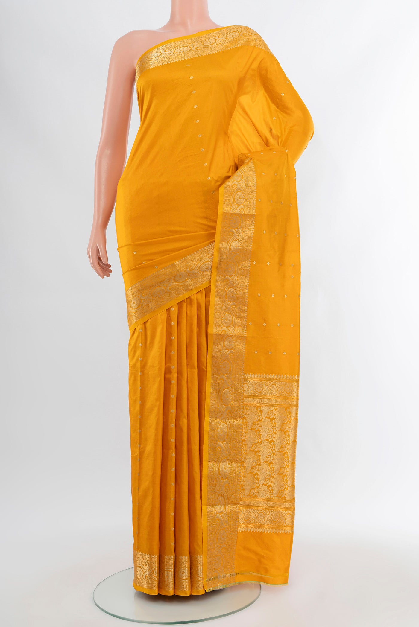 Yellow Banarasi Katan Silk Saree with Zari Butta on the body and Zari Border.  displayed on a mannequin