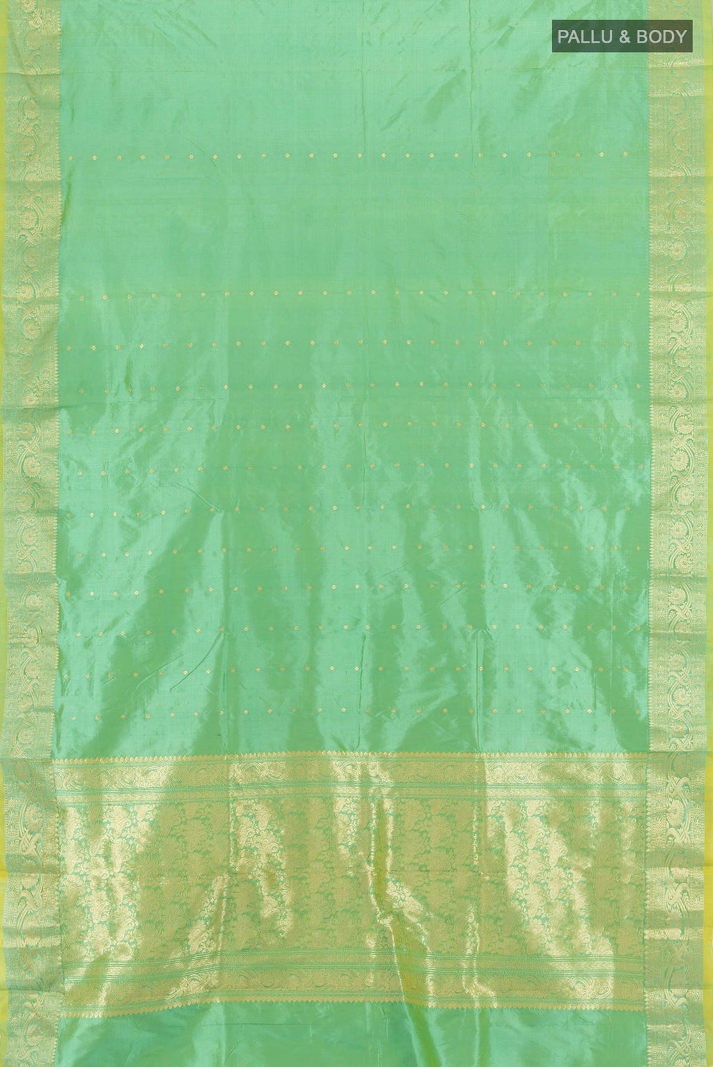 Flat view of Light Green Banarasi Katan Silk Saree with Zari Butta on the body and Zari Border. 